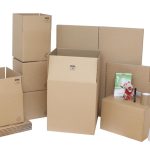 A variety of cardboard boxes, bubble wrap, and packing tape showcasing the best packaging materials supplier in the UK.